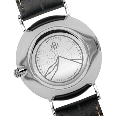 Back engraving of silver THT Arctica watch. Swiss watch movement.